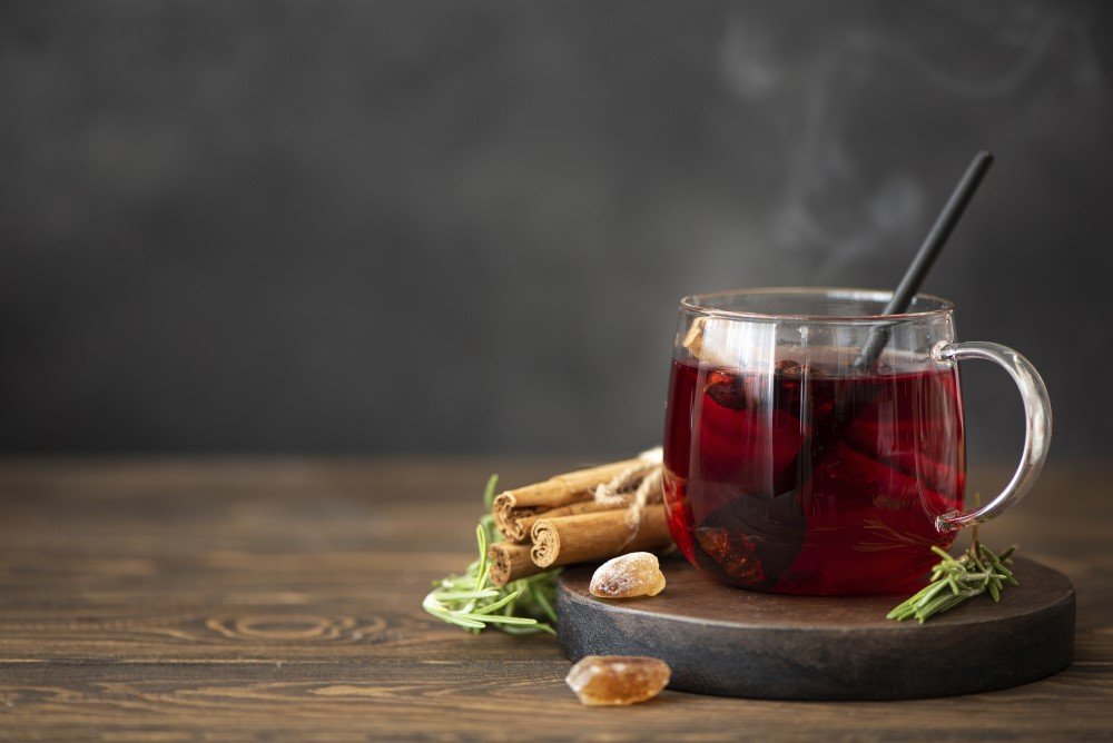 hot hibiscus tea with cinnamon sugar wooden table